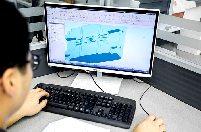 a engineer is designing a mold with CAD